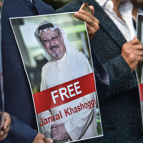 TOPSHOT - Protestors hold pictures of missing journalist Jamal Khashoggi during a demonstration in front of the Saudi Arabian consulate in Istanbul on October 5, 2018. - Jamal Khashoggi, a veteran Saudi journalist who has been critical towards the Saudi government has gone missing after visiting the kingdom's consulate in Istanbul on October 2, 2018, the Washington Post reported. (Photo by OZAN KOSE / AFP)        (Photo credit should read OZAN KOSE/AFP/Getty Images)