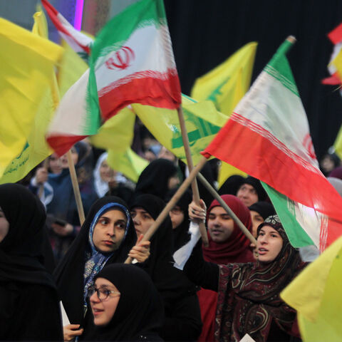 06 February 2019, Lebanon, Beirut: Supporters of Hezbollah, the pro-Iranian Lebanese Islamist political party and militant group, wave flags of Iran and Hezbollah during a rally to mark the 40th anniversary of the Iranian Islamic Revolution which toppled Mohammad Reza Pahlavi, the last Shah of Iran. Photo: Marwan Naamani/dpa (Photo by Marwan Naamani/picture alliance via Getty Images)