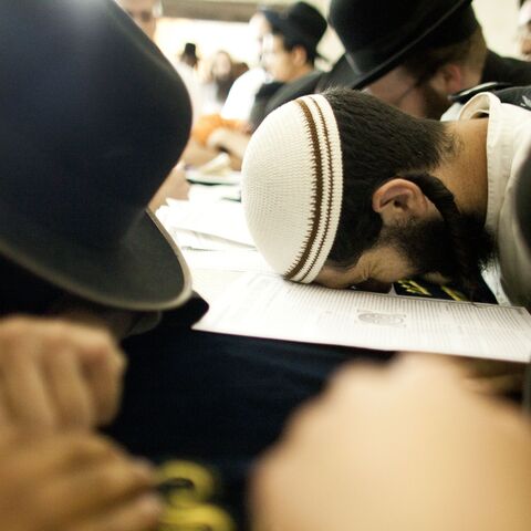 Jewish worshippers pray at Joseph's Tomb as hundreds of faithful mark the anniversary of the biblical Joseph's death, Nablus, West Bank, July 4, 2011. 