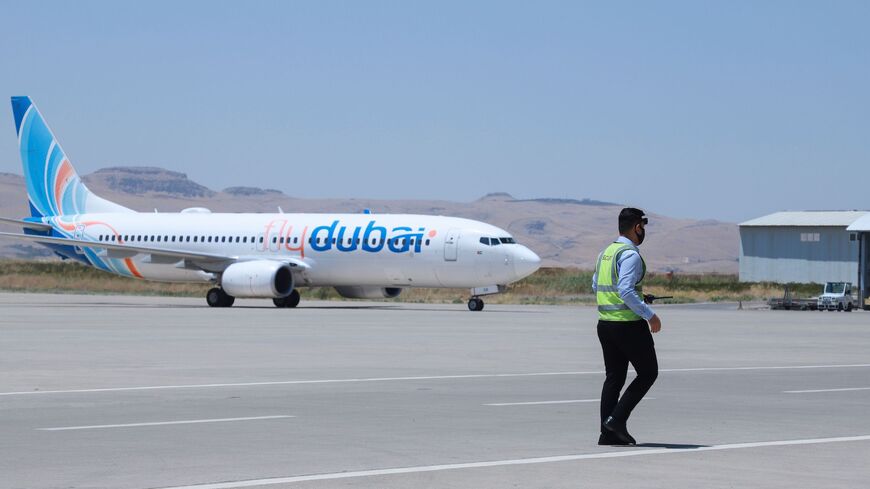 A Boeing 737 aircraft of Emirati airline FlyDubai is seen on the tarmac of Sulaimaniyah Airport in Iraq's autonomous Kurdish region on August 2, 2020, as the airport resumes flight operations following the COVID-19 lockdown.