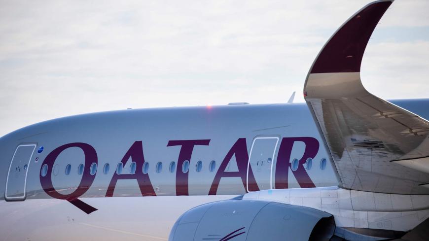 Fire engines spray water to greet a plane of Qatar Airways from Doha as it landed at Berlin's airport "Berlin Brandenburg Airport Willy Brandt", during the opening of the southern runway of the airport, in Schoenefeld, southeast of Berlin, on November 4, 2020. - Passenger flights are to began landing on October 31, 2020 at Berlin's new international airport, a moment many Germans thought they might never see after years of embarrassing delays and spiralling costs. (Photo by Odd ANDERSEN / AFP) (Photo by ODD