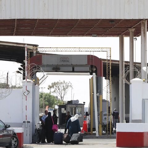 A picture taken on Sept. 17, 2021, shows people queuing to cross into Tunisia through the Libyan Ras Jdeir border crossing.