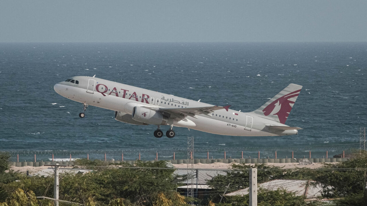 A Qatar Airways plane takes off from Aden Adde International Airport in Mogadishu, Somalia, Feb. 12, 2022.