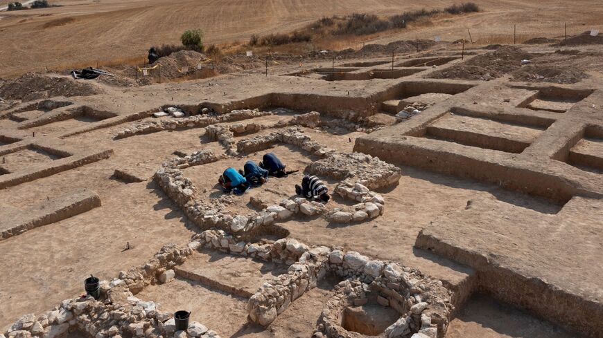 Muslim Palestinian workers of Israel's Antiquities Authority pray amid the remains of a recently discovered ancient mosque.