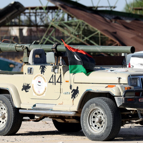 Joint forces affiliated with Libya's Government of National Unity assemble inside the closed Tripoli International Airport, as they deploy on the outskirts and entrances of the capital Tripoli on July 25, 2022. - At least 16 people were killed and 52 wounded in fighting between armed groups in Tripoli, the health ministry said on July 23, following the latest politically driven violence to hit the Libyan capital. (Photo by Mahmud Turkia / AFP) (Photo by MAHMUD TURKIA/AFP via Getty Images)