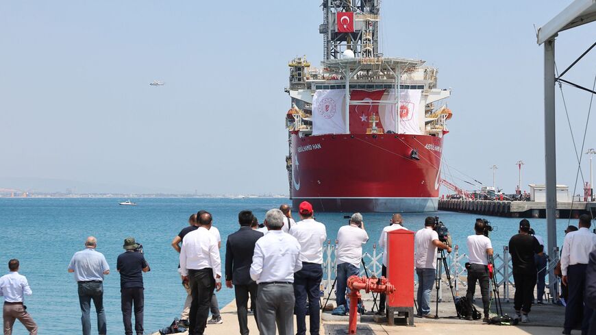 Media film and photograph the Abdulhamid Han drill ship, the fourth built by Turkey, in Mersin on August 9, 2022 before it leaves for gas exploration to an undisputed area in the Mediterranean Sea, in south of the city of Gazipasa. - Turkey on August 9, 2022 sent its newest drill ship on the first eastern Mediterranean energy exploration mission in nearly two years. The search for natural gas in energy-rich waters around the divided island of Cyprus has turned into an irritant in Turkey's ties with the Euro