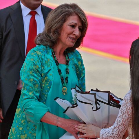 Iraq's new first lady and Iraqi-Kurdish politician and writer Shanaz Ibrahim Ahmed receives a bouquet of flowers during her husband's inauguration and handover ceremony as the new Iraqi president at al-Salam Palace in the capital Baghdad on Oct. 17, 2022.