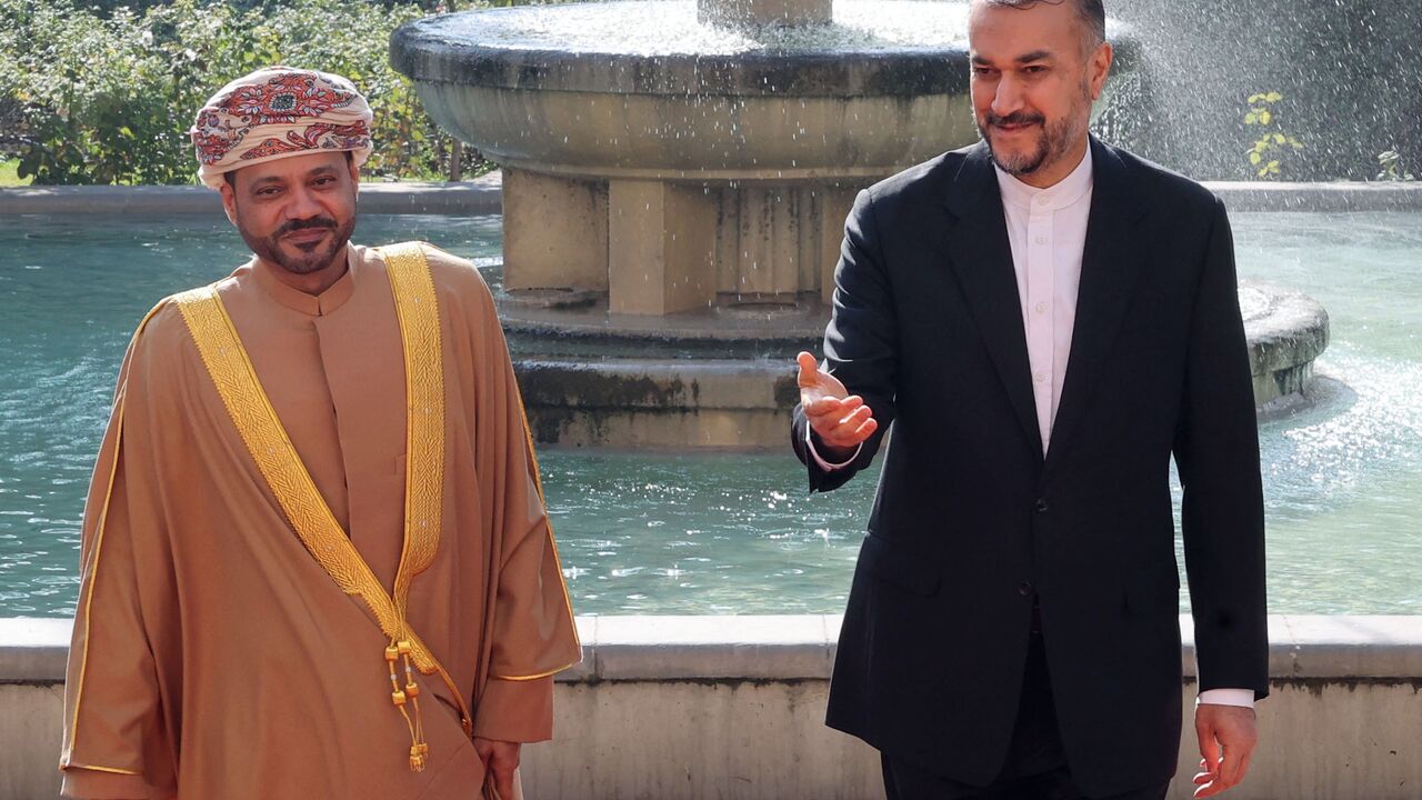 Iranian Foreign Minister Hossein Amir-Abdollahian (R) welcomes his Omani counterpart Sayyid Badr al-Busaidi in Tehran on November 19, 2022. (Photo by ATTA KENARE / AFP) (Photo by ATTA KENARE/AFP via Getty Images)