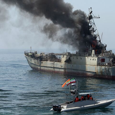 Iran's elite Revolutionary Guard boats attack a naval vessel during a three-day military drill in the Gulf on April 22, 2010. 