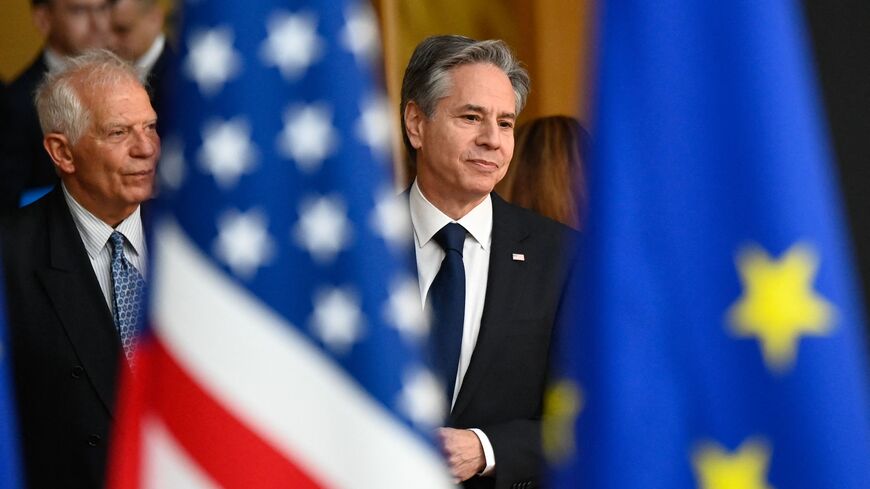 US Secretary of State Antony Blinken (R) and and European Union High Representative for Foreign Affairs and Security Policy Josep Borrell walk past the US and EU flags as they arrive for an EU-US Energy Council Ministerial Meeting in Brussels on April 4, 2023. (Photo by John THYS / AFP) (Photo by JOHN THYS/AFP via Getty Images)