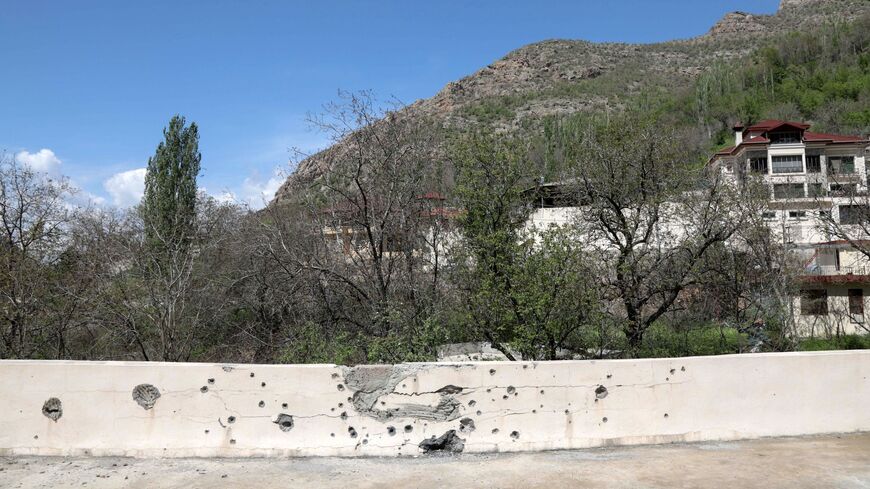 This picture taken on April 25, 2023, shows a shrapnel-pocked walled in the village of Hiror near the Turkish border in northern Iraq's autonomous Kurdish region.