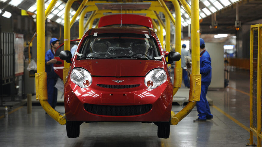 In this picture taken on October 26, 2011 workers assemble one of the many car models at Chinese carmaker's Chery Automobile plant in Wuhu, east China's Anhui province. The growth of China's car market will be driven primarily by exports this year because domestic sales have slowed dramatically, as the world's largest car market -- sold 614,000 cars abroad in the first nine months of 2011, a 60 percent rise on the same period in 2010. CHINA OUT AFP PHOTO (Photo credit should read STR/AFP via Getty Images)