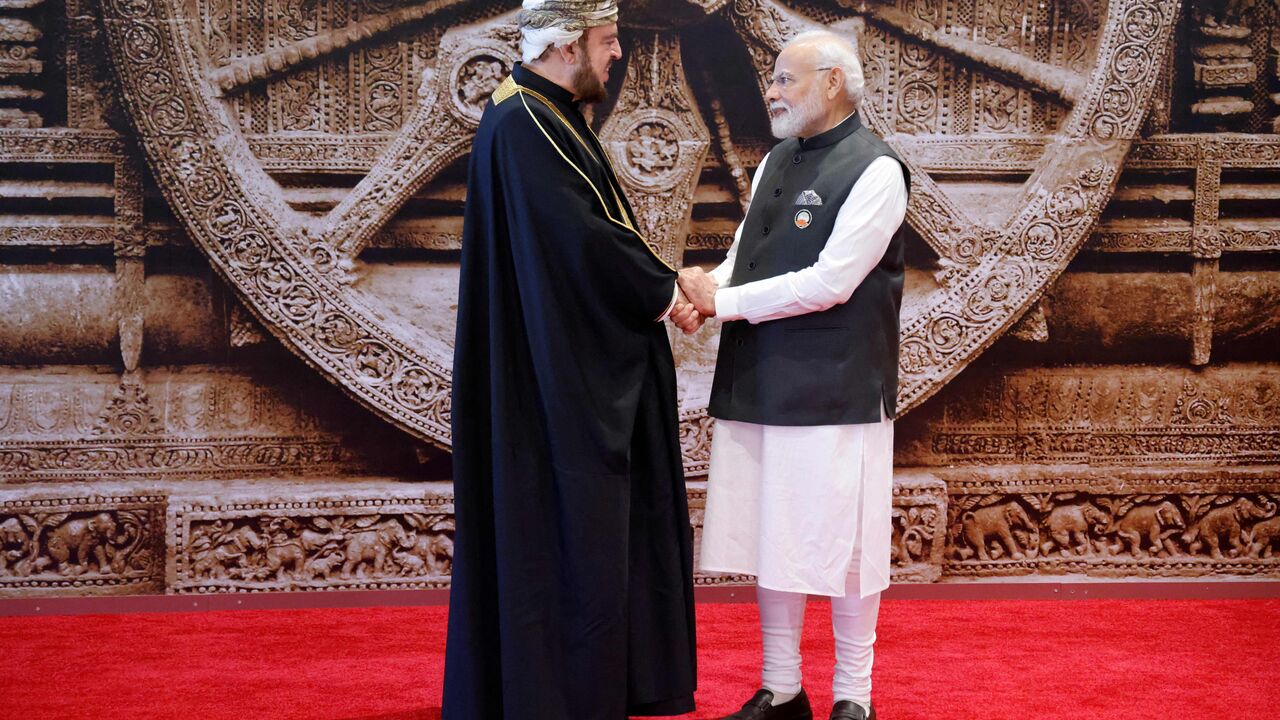 India's Prime Minister Narendra Modi (R) shakes hand with Deputy Prime Minister of Oman Sayyid Asaad ahead of the G20 Leaders' Summit in New Delhi on September 9, 2023. (Photo by Ludovic MARIN / POOL / AFP) (Photo by LUDOVIC MARIN/POOL/AFP via Getty Images)