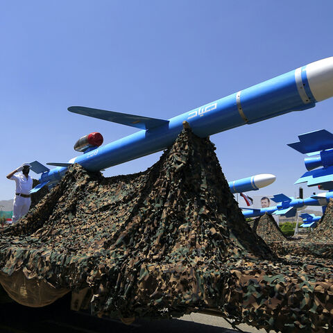 Houthi soldiers stand guard on a missile carrier during an official military parade marking the ninth anniversary of the Houthi takeover of the capital, Sanaa, on Sept. 21, 2023. 