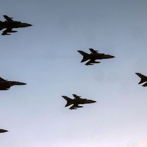 Royal Saudi Air Force Panavia Tornado and F-15 Eagle fighter aircraft fly over during an airshow marking Saudi Arabia's 93rd National Day celebrations in Riyadh on September 23, 2023. (Photo by Fayez Nureldine / AFP) (Photo by FAYEZ NURELDINE/AFP via Getty Images)