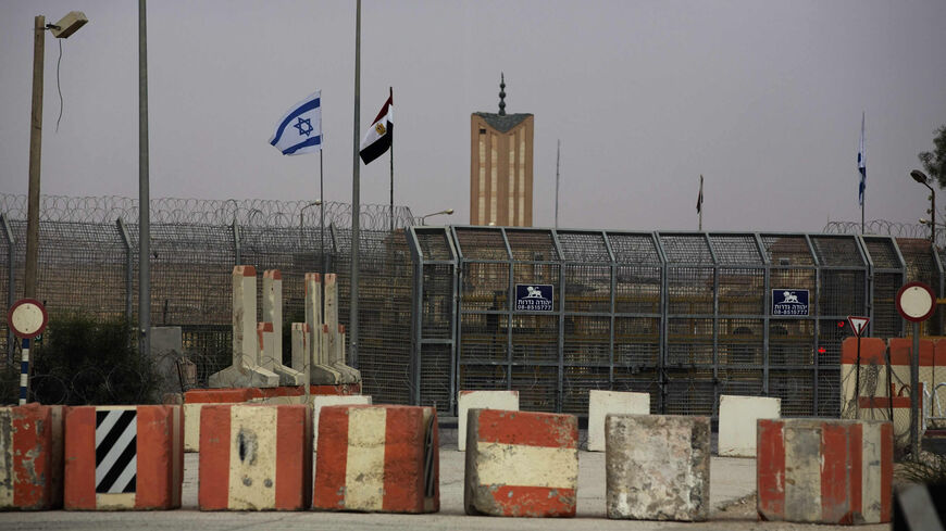 Israeli and Egyptian flags are seen at the Nitzana border crossing along the southern Israeli border with Egypt near the Israeli village of Nitzanei, Sinai Peninsula, Aug. 20, 2013.