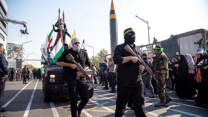 11/24/2023 Tehran, Iran. Members of the Islamic Revolutionary Guard Corps (IRGC) are wearing Palestinian scarves and carrying handheld anti-tank grenade launchers as they participate in the Ela Beit Al-Moghaddas (Al-Aqsa Mosque) military rally in Tehran, Iran. (Photo by Hossein Beris / Middle East Images / Middle East Images via AFP) (Photo by HOSSEIN BERIS/Middle East Images/AFP via Getty Images)