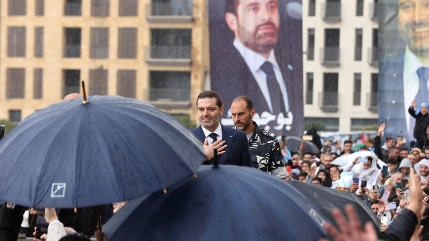 Former Lebanese prime minister Saad Hariri greets his supporters after he prayed at the grave of his father, slain prime minister Rafic Hariri, during a commemoration for the 19th anniversary of his assassination, in Beirut, on February 14, 2024. (Photo by ANWAR AMRO / AFP) (Photo by ANWAR AMRO/AFP via Getty Images)