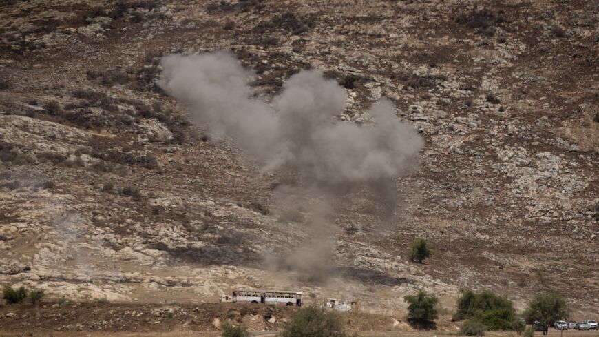 Smoke rises after a strike near a military base in northern Israel by a rocket fired by Hezbollah, July 4, 2024. 