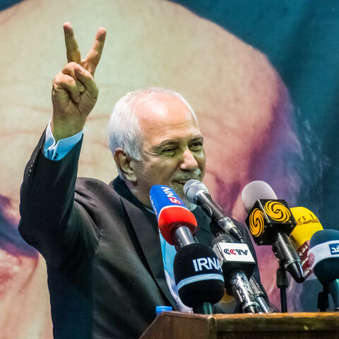 Mohammad Javad Zarif, the former Iranian Foreign Minister, flashes victory sign during an election rally in support of  Iranian presidential election candidate Masoud Pezeshkian in Tehran, Iran, on June 24, 2024. Iran is holding snap presidential elections to choose the next president after the death of Ebrahim Raisi in a helicopter crash. After the election with a historically low turnout on Friday, Masoud Pezeshkian, Iran's presidential election candidate and former reformist member of the Iranian parliam