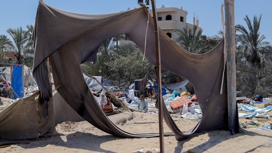 A Palestinian praysfollowing an Israeli military strike on the al-Mawasi camp for internally displaced people (IDP), near the city of Khan Younis, southern Gaza Strip, July 13, 2024.