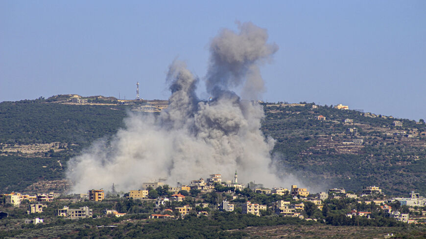 TOPSHOT - Smoke billows following an Israeli airstrike in the southern Lebanese border village of Chihine on July 28, 2024. Fallout from the Gaza war is regularly felt on the Israel-Lebanon frontier, where deadly cross-border exchanges have escalated between Israeli troops and mainly Hezbollah fighters. (Photo by KAWNAT HAJU / AFP) (Photo by KAWNAT HAJU/AFP via Getty Images)