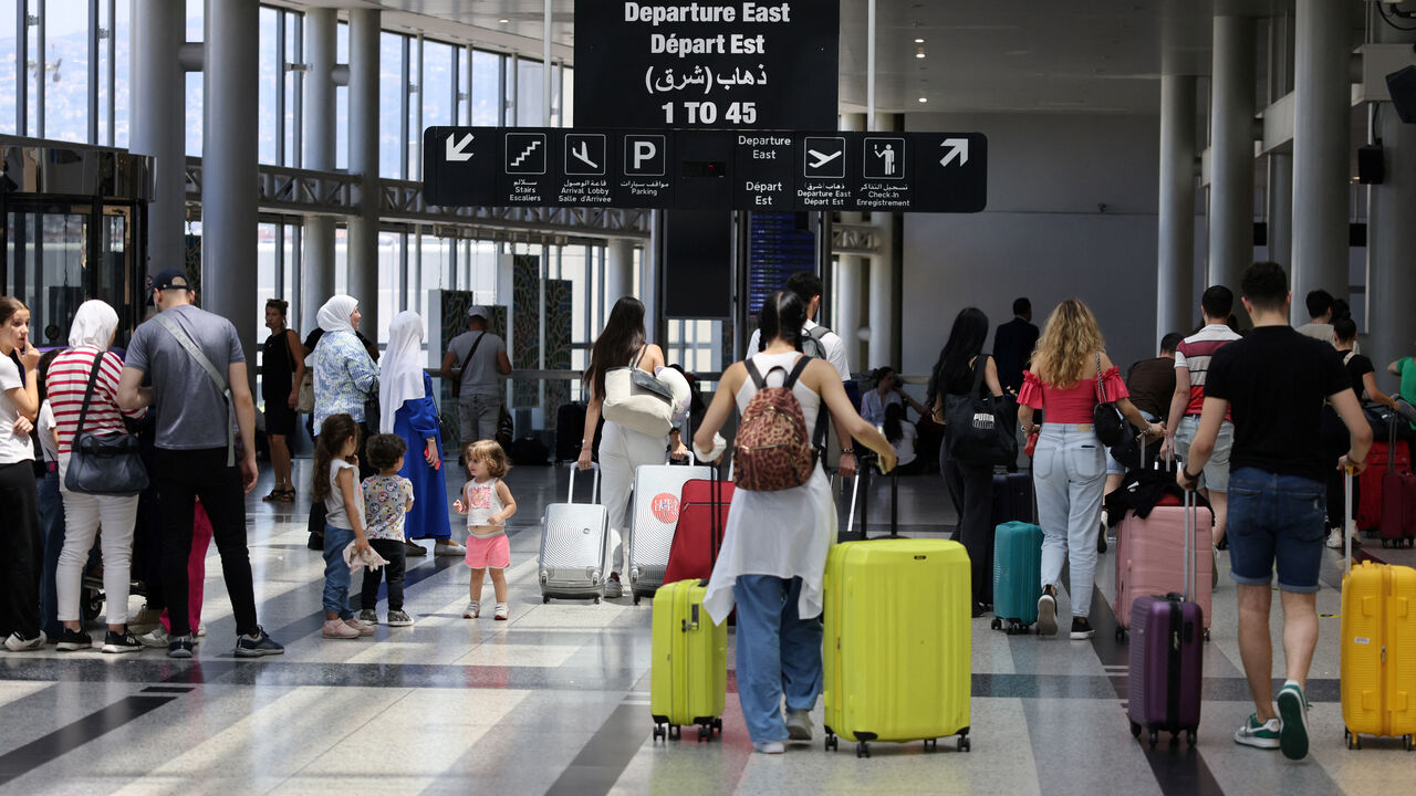 Passengers departure from Rafic Hariri International Airport in Beirut on July 29, 2024. Airlines suspended flights to Lebanon on July 29, as diplomatic efforts were underway to contain soaring tensions between Hezbollah and Israel after deadly rocket fire in the annexed Golan Heights. (Photo by Anwar AMRO / AFP) (Photo by ANWAR AMRO/AFP via Getty Images)