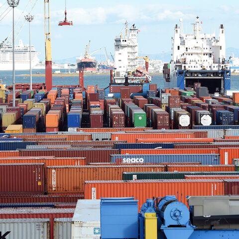 Cargo ships unload imported goods in the Tunisian port city of Rades on November 12, 2014. The World Bank said in a report published last September that Tunisia's economic model of manufacturing for exports and protecting the domestic market was valid in the 1970s but since then had hindered progress. AFP PHOTO / FETHI BELAID (Photo credit should read FETHI BELAID/AFP via Getty Images)