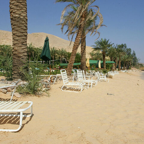 TABA, EGYPT: Beach resorts close to the Egyptian Taba Hilton (background-R) remain empty 11 October 2004, four days after three attacks targeted this well-known hotel in the Sinai peninsula next to the Israeli border and another two minor resorts, killing at least 32 people and causing the exodus of thousands of Israeli tourists from the area called the Egyptian Riviera. Israel's resort of Eilat, close to the border with Egypt, is set for a boom as thousands of Israelis who regularly holiday in Sinai look e