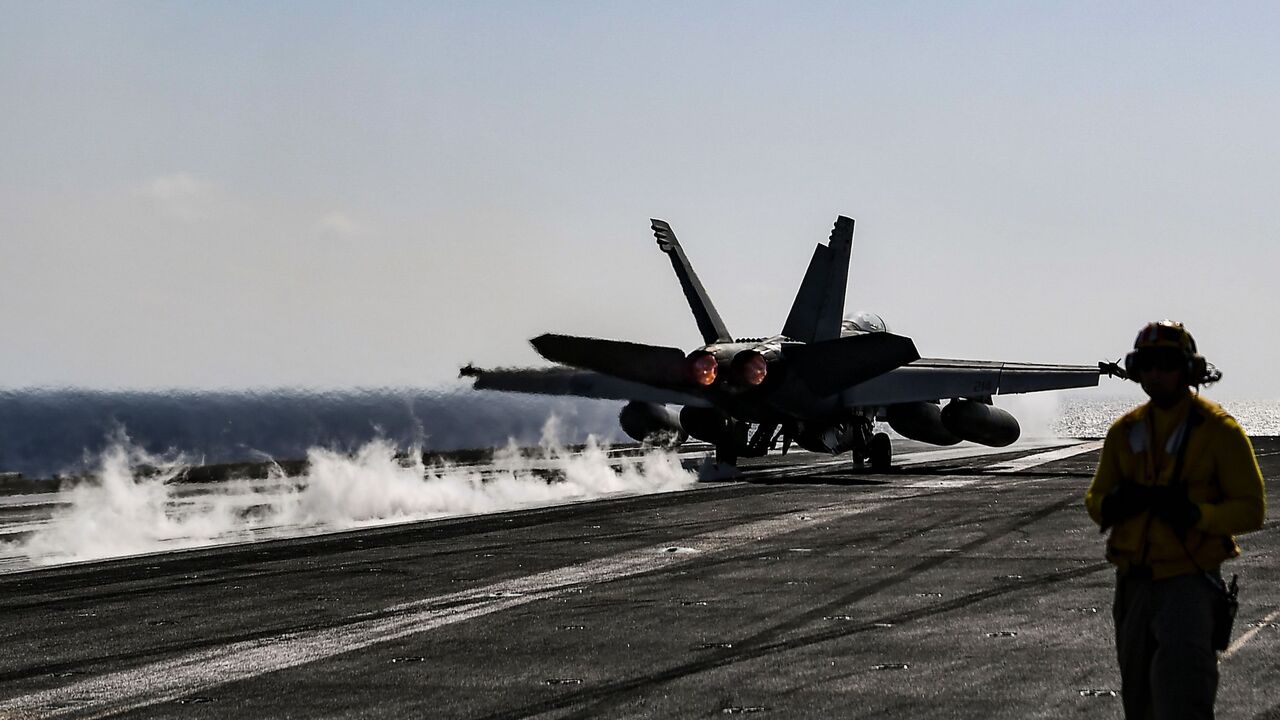 A F18 Hornet fighter jet pilot takes off from the deck of the US navy aircraft carrier USS Harry S. Truman in the eastern Mediterranean Sea on May 8, 2018. 