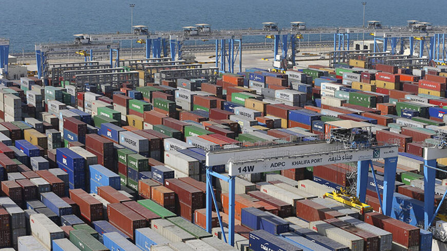 An aerial view of Khalifa Port is seen in Abu Dhabi April 10, 2014. State-owned Abu Dhabi Ports Co (ADPC) expects a surge in shipping traffic towards the end of this year as work on major infrastructure projects in the United Arab Emirates capital gathers pace, the company's chief executive said. Khalifa Port, built on a man-made island roughly half-way between Abu Dhabi and Dubai, came on stream in 2012 after Zayed Port, which had been serving Abu Dhabi for over 40 years, reached full capacity. Picture tak