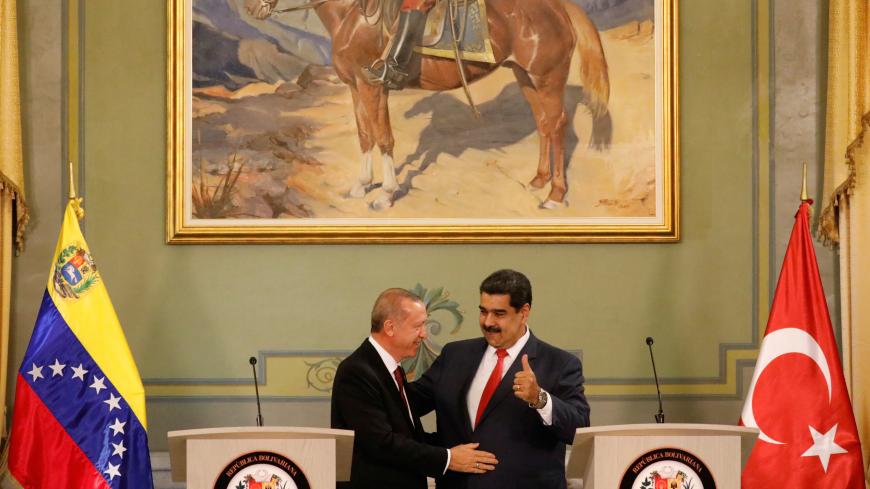 Turkish President Tayyip Erdogan and Venezuela's President Nicolas Maduro attend a news conference after an agreement-signing ceremony between Turkey and Venezuela at Miraflores Palace in Caracas, Venezuela December 3, 2018. REUTERS/Manaure Quintero - RC15C01C8740