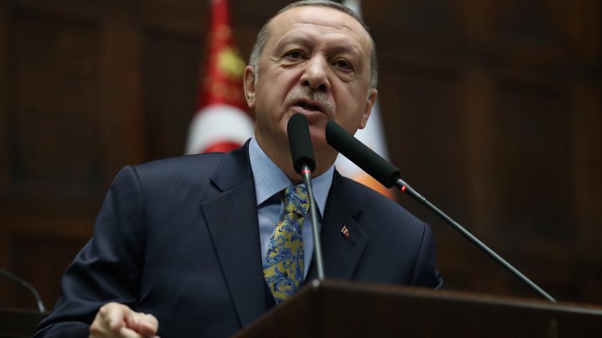 Turkish President Tayyip Erdogan addresses members of parliament from his ruling AK Party (AKP) during a meeting at the Turkish parliament in Ankara, Turkey, January 15, 2019. REUTERS/Umit Bektas - RC1EDE066F60