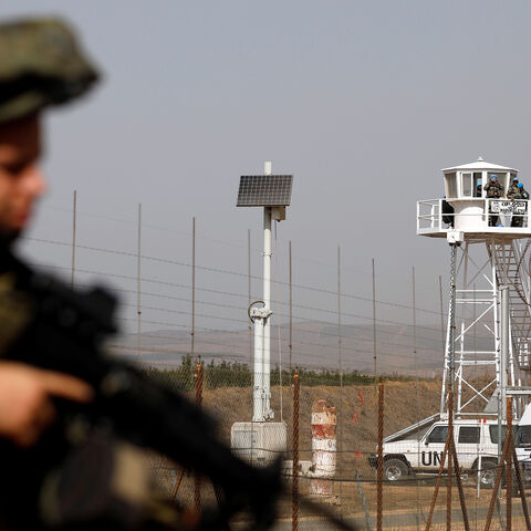 An Israeli soldier stands near the Quneitra crossing in the Golan Heights on the border line between Israel and Syria, October 15, 2018. REUTERS/Amir Cohen - RC1FD4BF4A00