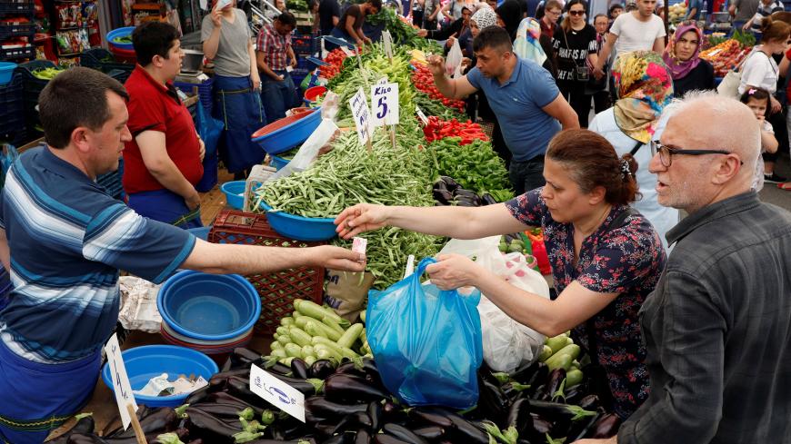 People shop at a bazaar in Istanbul, Turkey, May 29, 2019. REUTERS/Murad Sezer - RC1904437D30