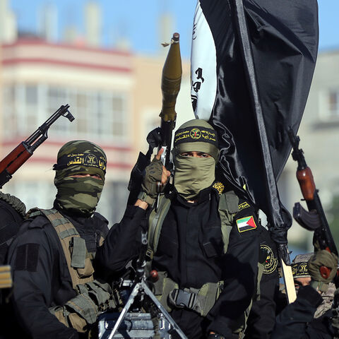 Palestinian Islamic jihad militants take part in a military show marking the 32nd anniversary of the organisation's founding, in the central Gaza Strip October 3, 2019. REUTERS/Ibraheem Abu Mustafa - RC17E1BD1920