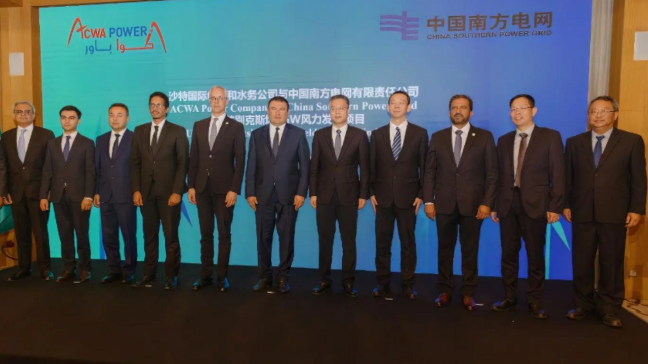 ACWA Power and China Southern Power Grid representatives.